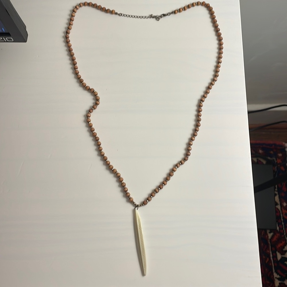 Wood bead necklace with feather pendant
